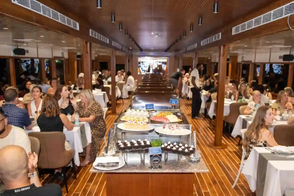 Guests dining on a dinner cruise Dubai Marina,UAE